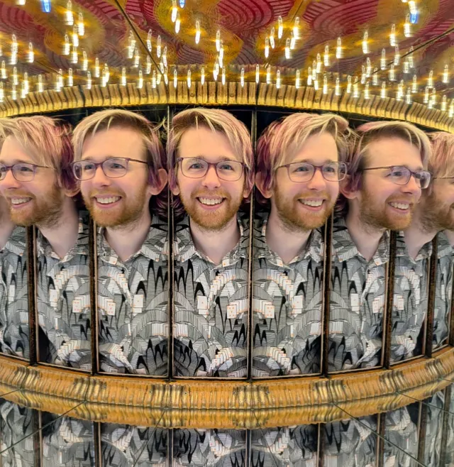 Spencer looking through an infinity mirror